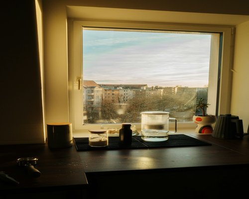 quiet evening routine with a glass of water and soft ambient light inside an apartment